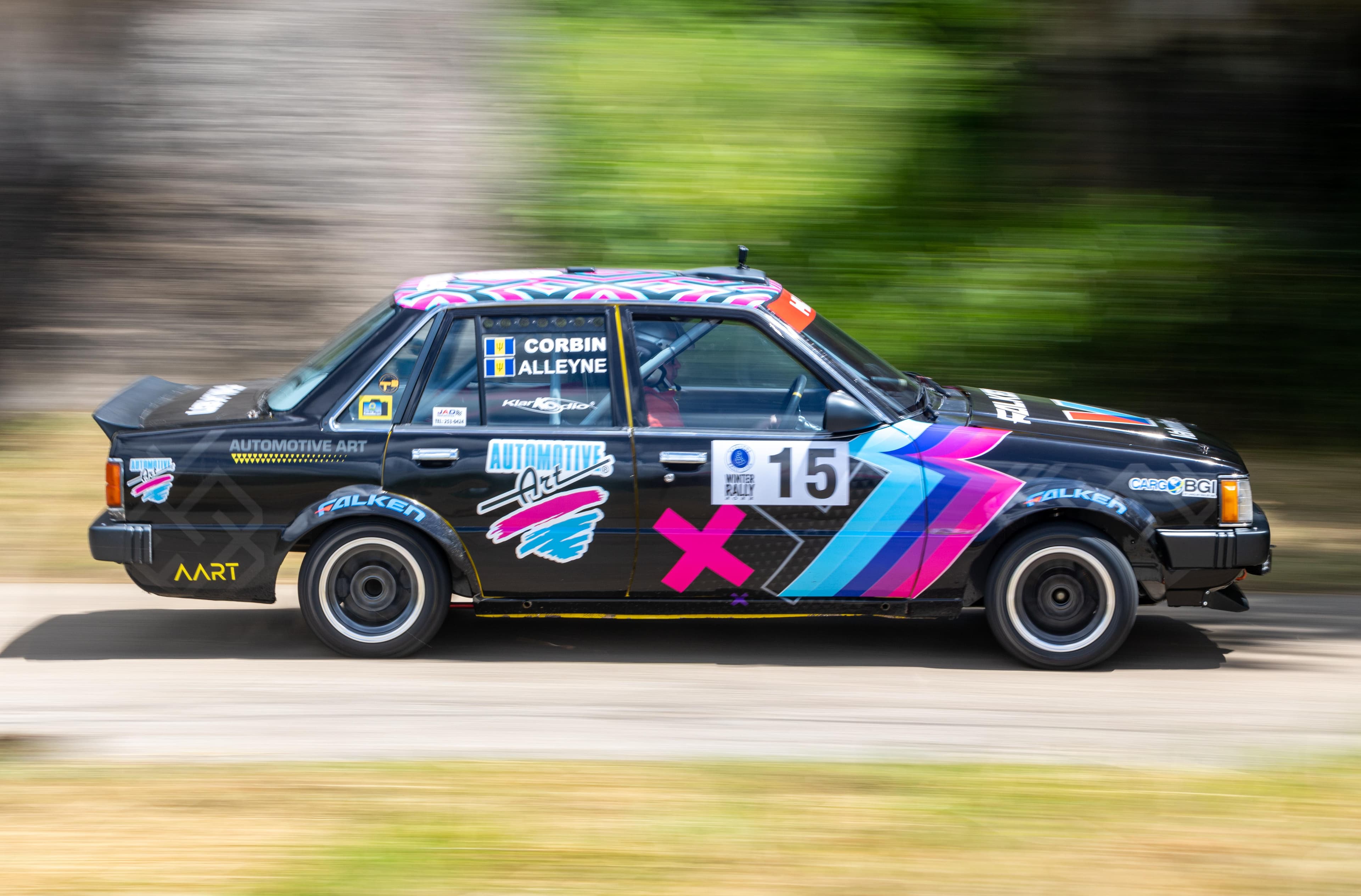 GT race car on the starting grid with pit crew