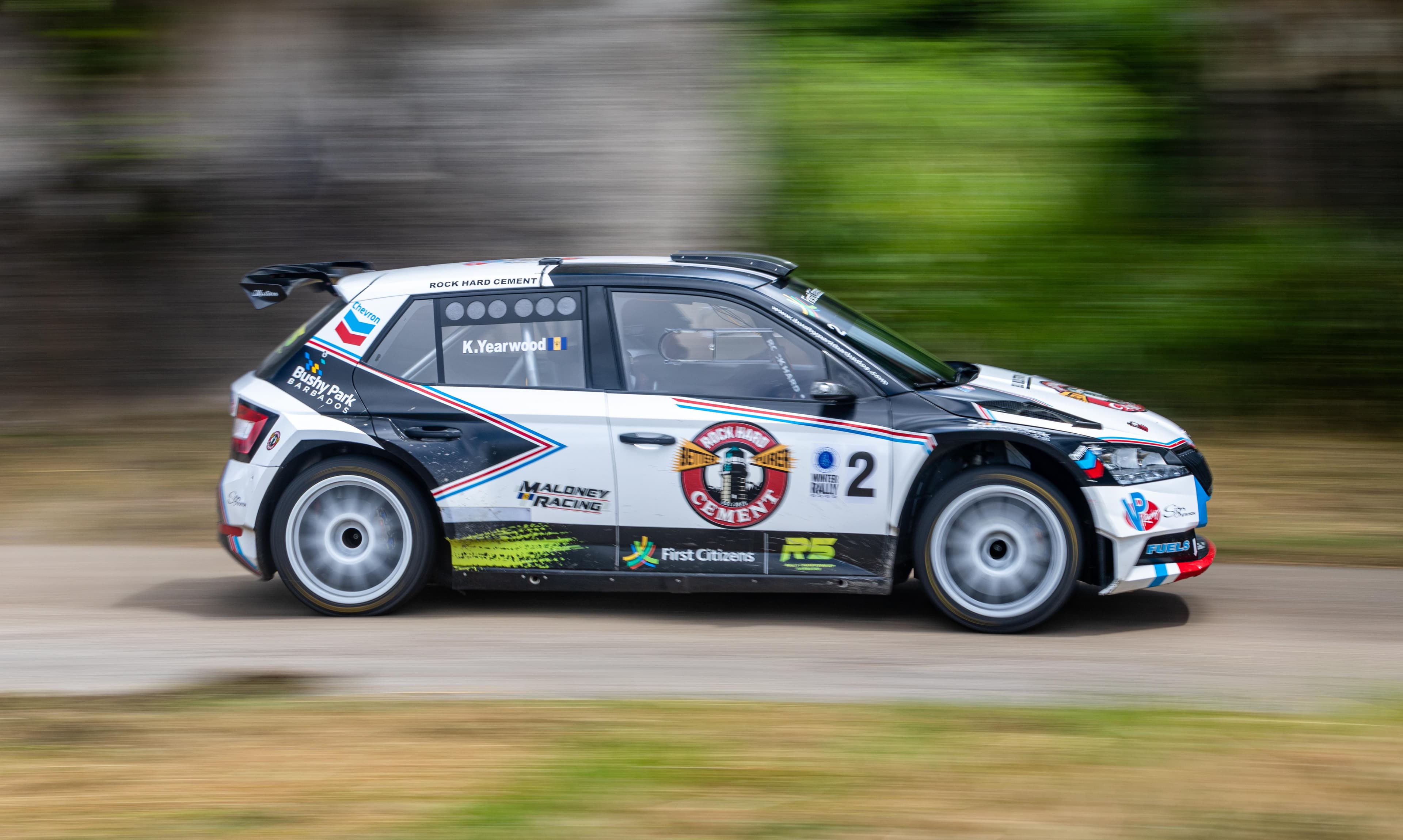 GT race car pit stop with crew changing tires