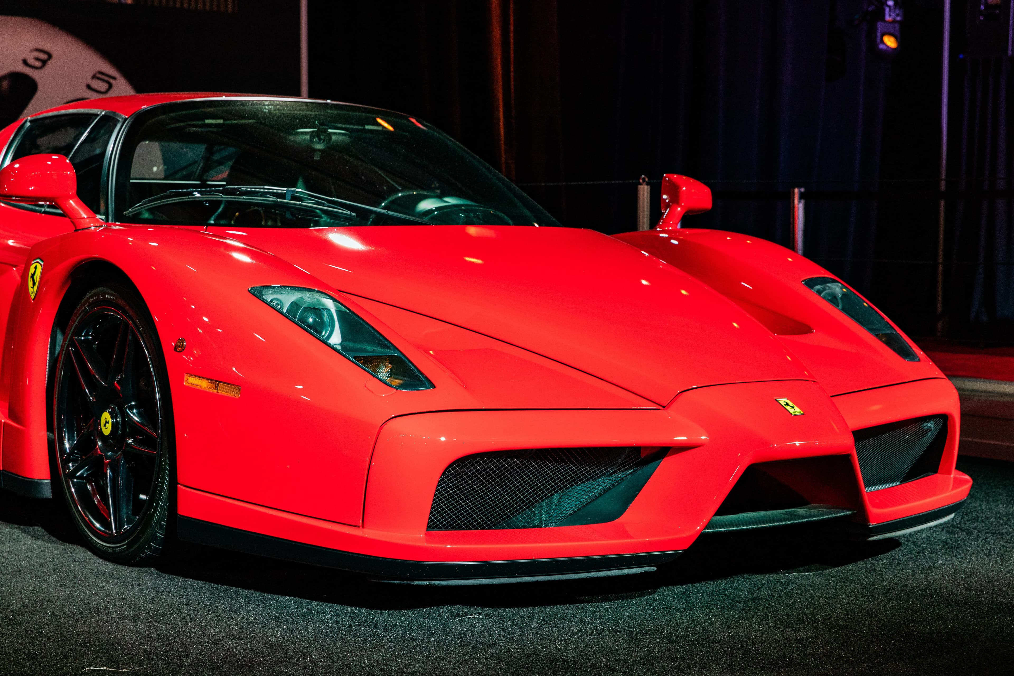 Rear of drift car mid-slide with smoke and sparks