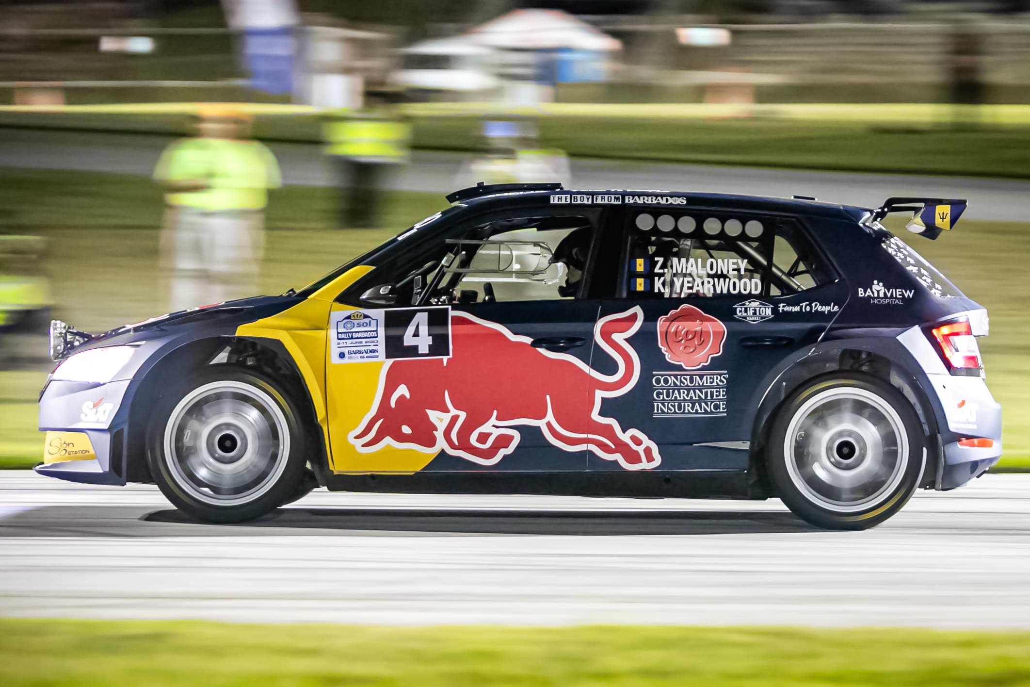 Race car speeding through a corner at sunset