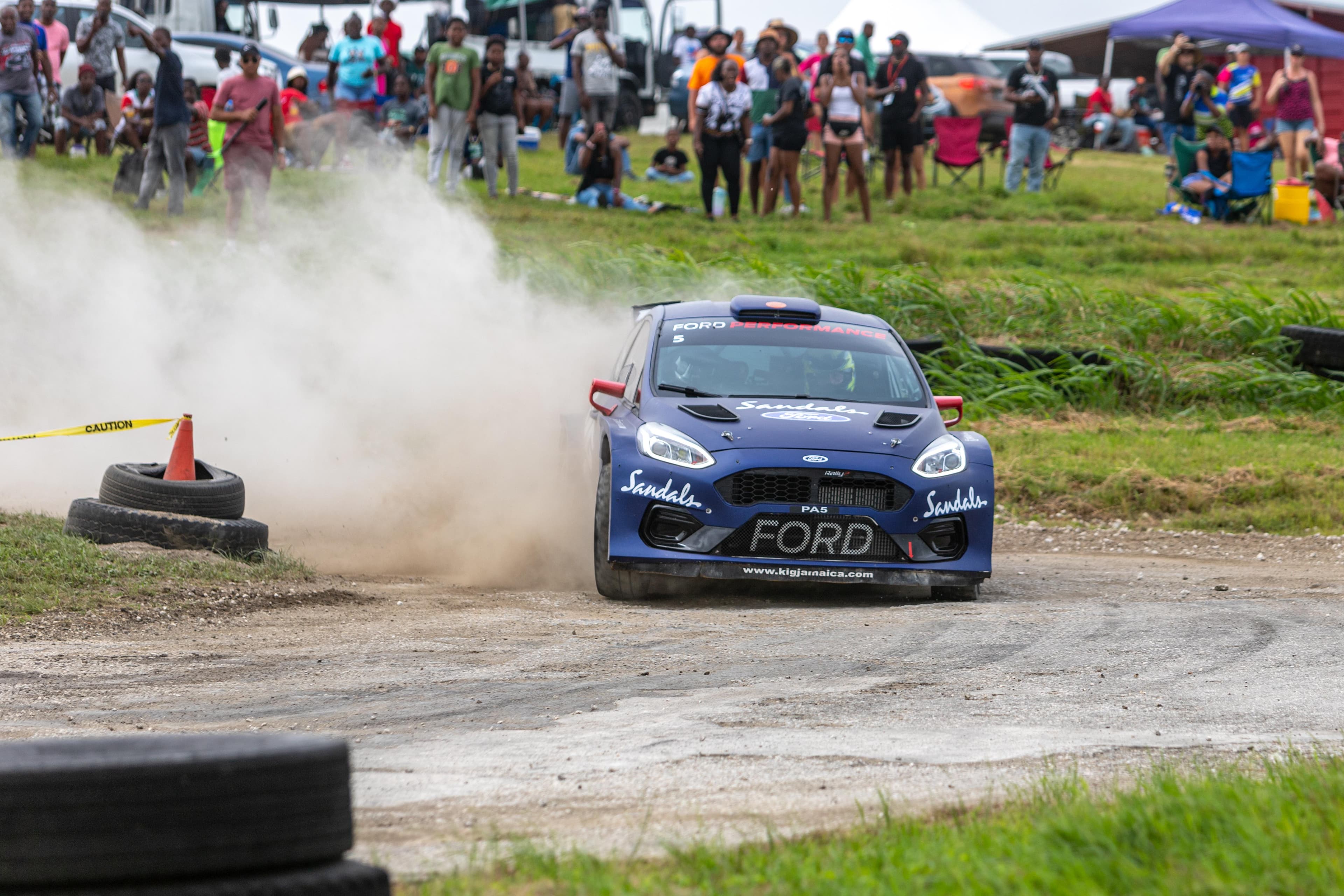 Rally car engine bay during pit service